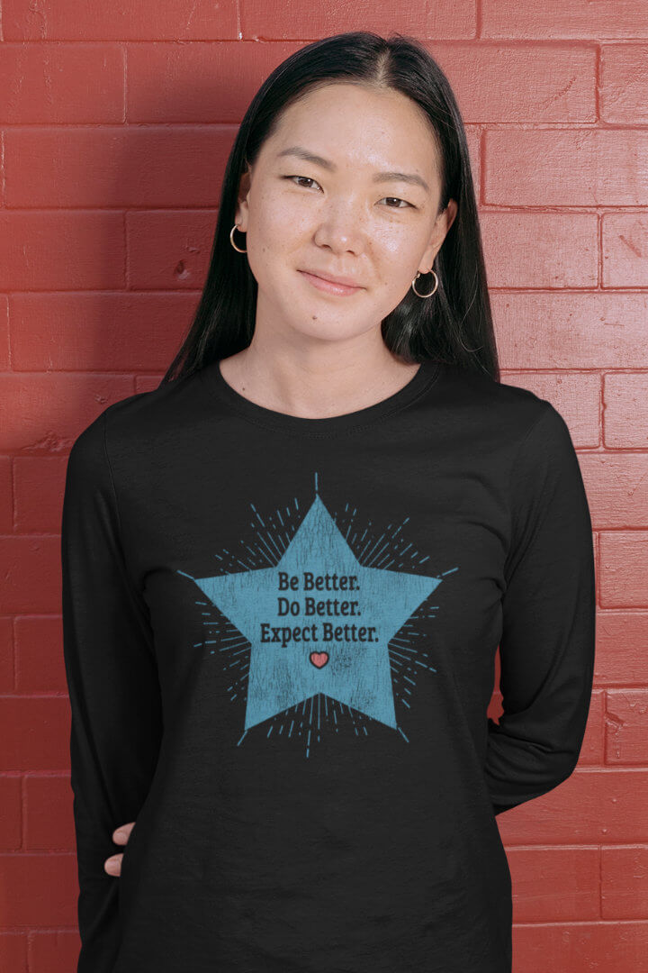 young woman wearing Be Better. Do Better. Expect Better long sleeve Tee